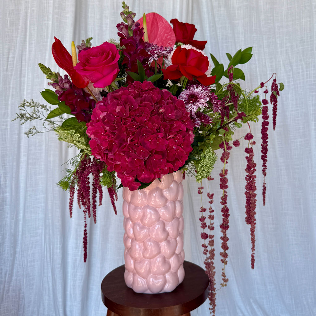 Valentine's Day flower bouquet featuring romantic red and pink blooms